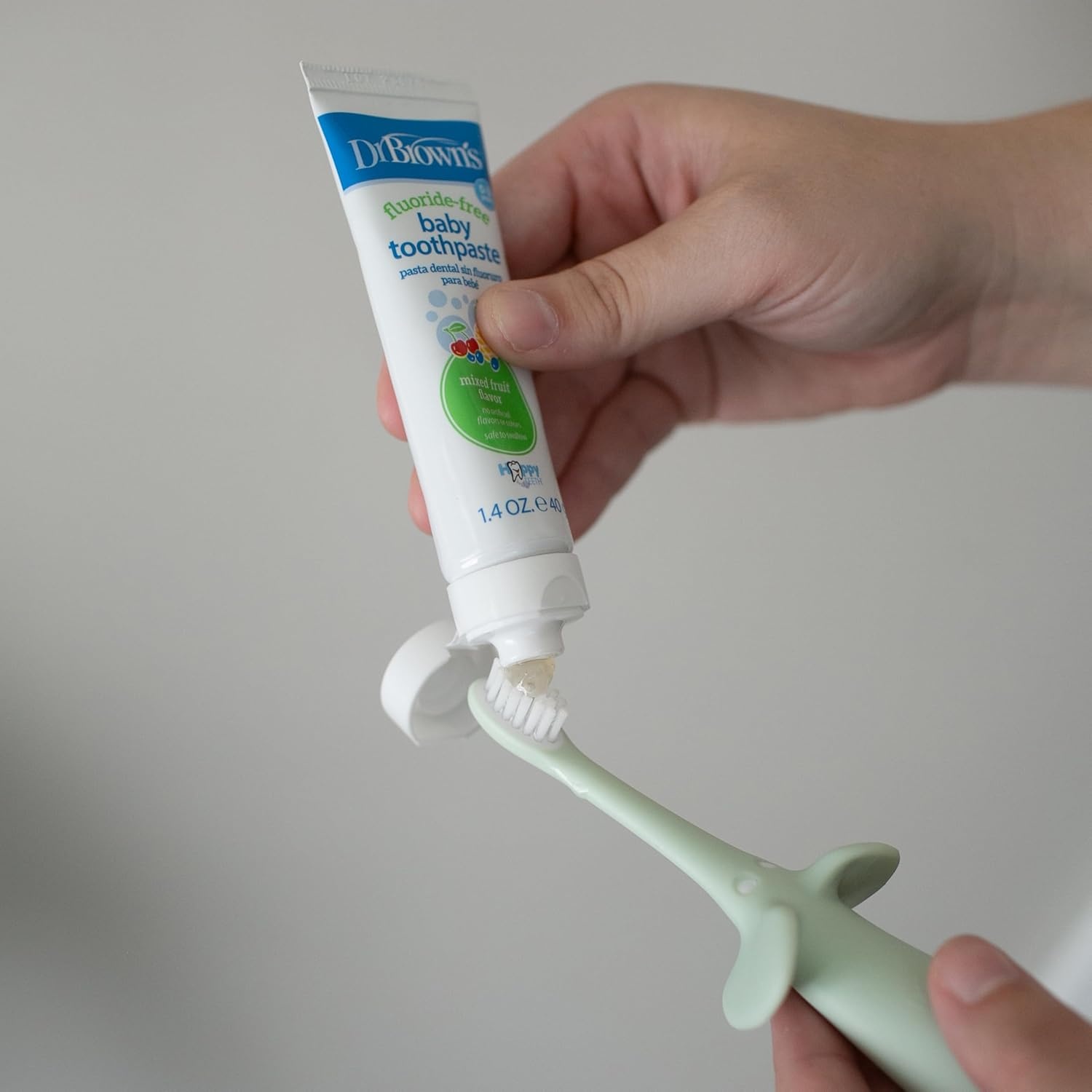 image:imageDr Browns InfanttoToddler Training Toothbrush Set Mint Elephant with FluorideFree Strawberry Baby Toothpaste 03 years