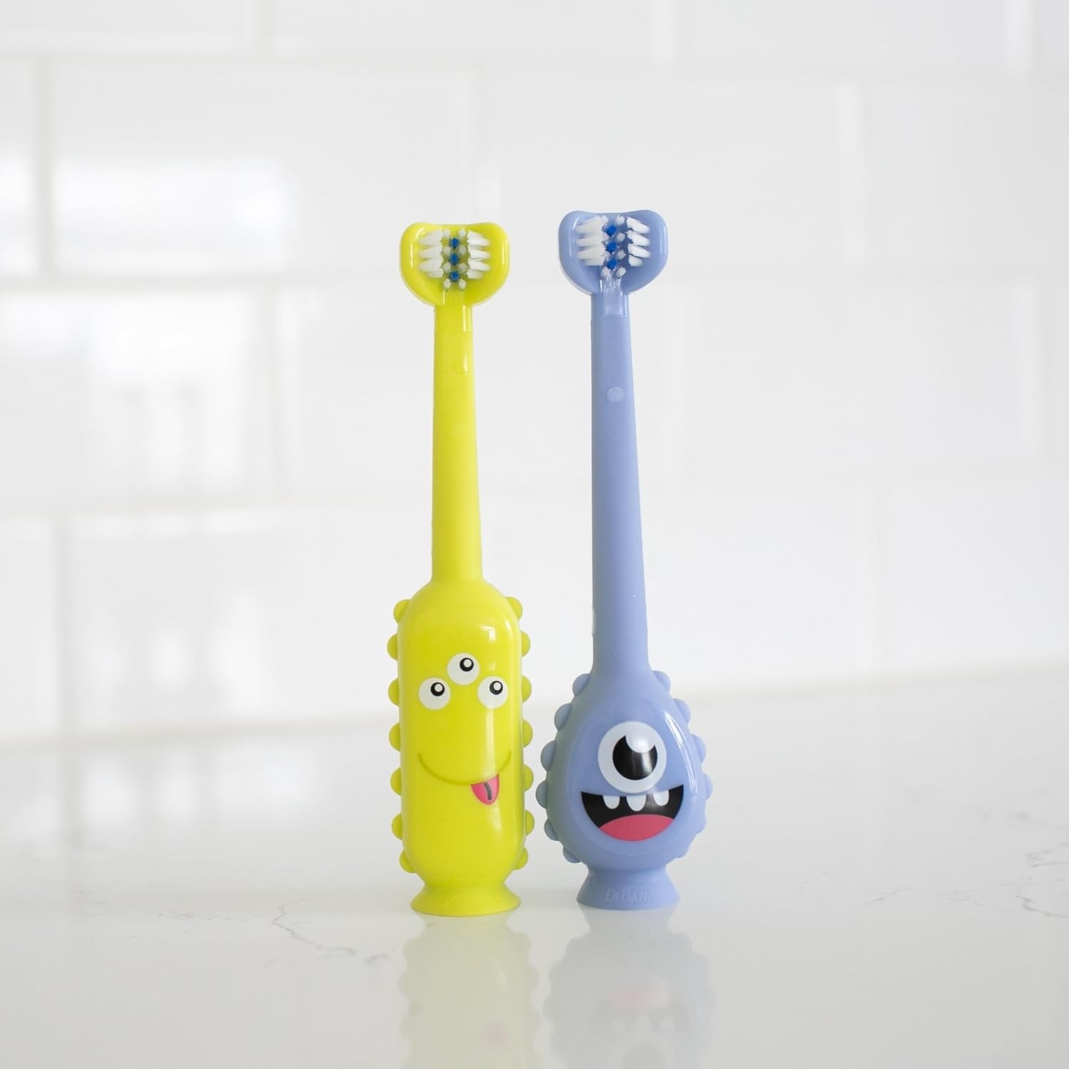 image:imageDr Browns ToothScrubber Toddler Toothbrush TripleSided Training Toothbrush with Suction Cup Base Green Monster Baby Oral Care Ages 14 Years1 Pack Green Monster
