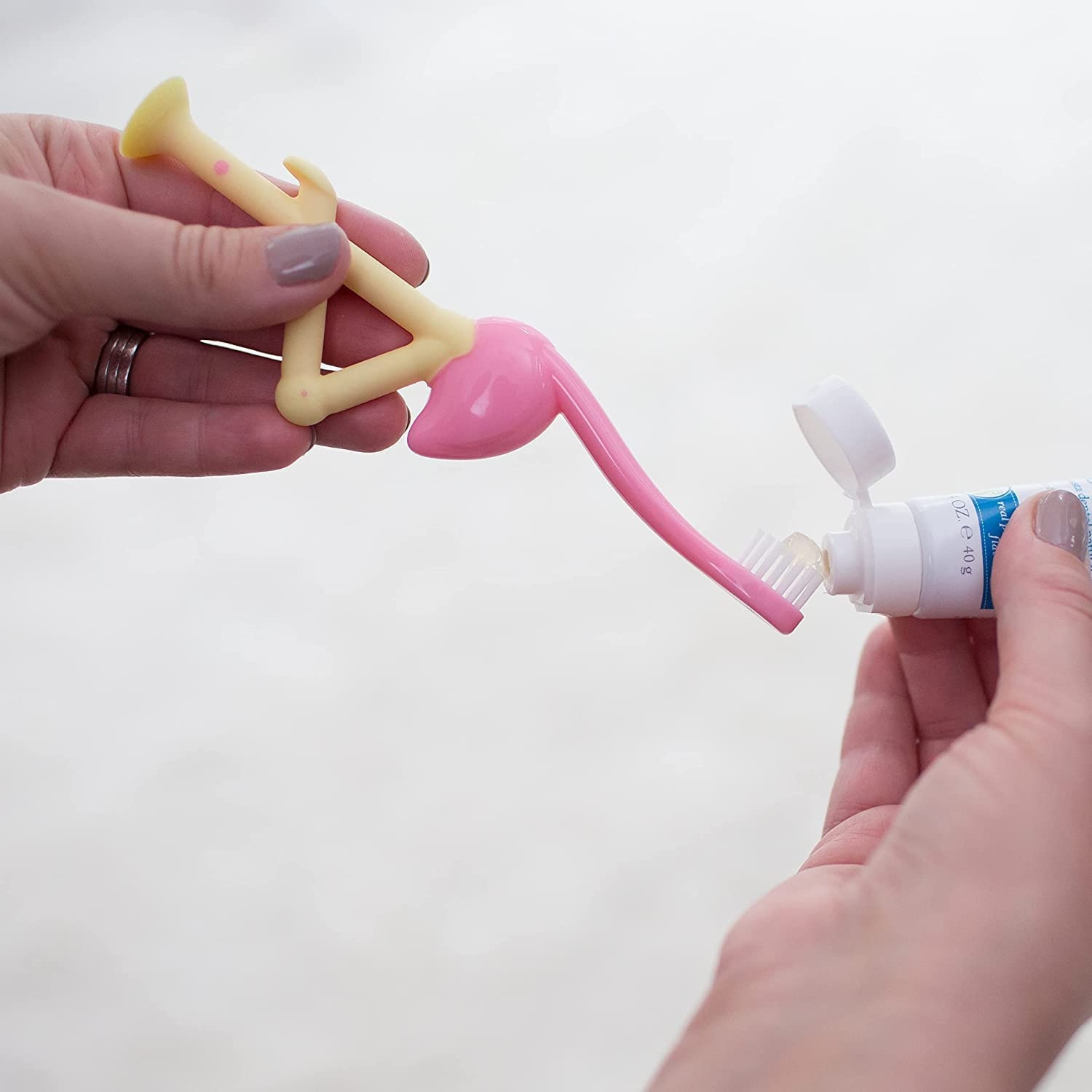 image:imageDr Browns ToothScrubber Toddler Toothbrush TripleSided Training Toothbrush with Suction Cup Base Green Monster Baby Oral Care Ages 14 Years2 Pack Toddler Toothbrush Purple Monster Flamingo
